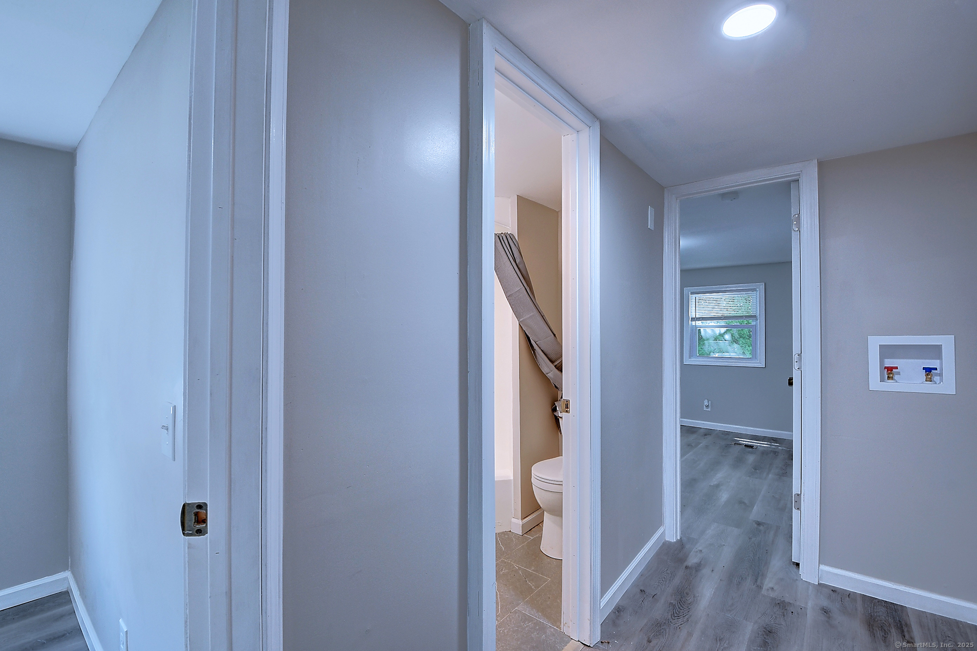 66 Nancy Lane Naugatuck, CT 06770 - Photo 20 of 25 a view of a hallway with wooden floor and closet area