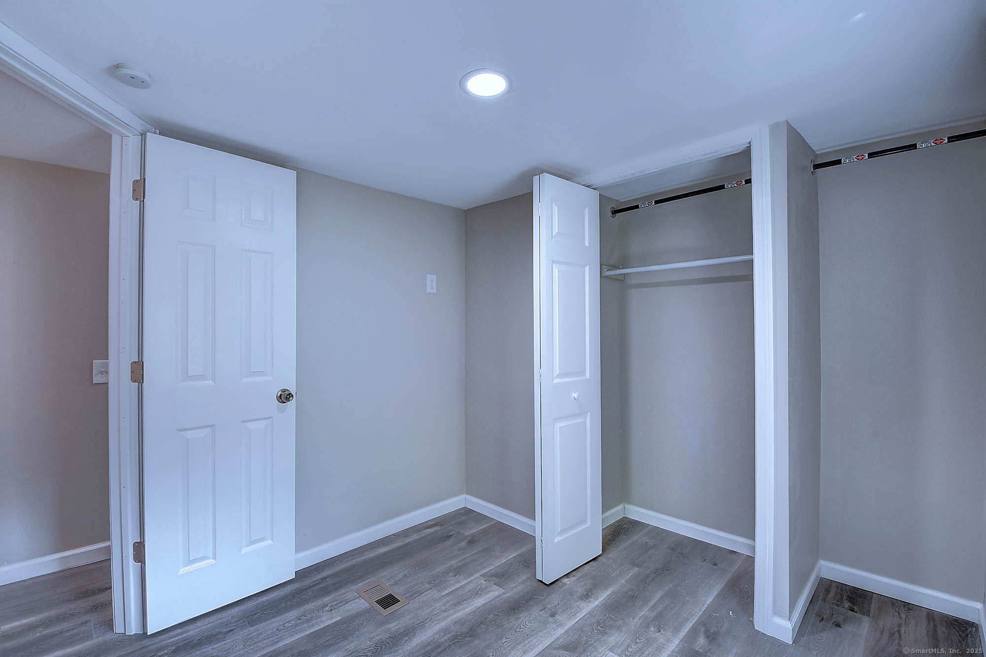 66 Nancy Lane Naugatuck, CT 06770 - Photo 23 of 25 a view of an empty room with wooden floor