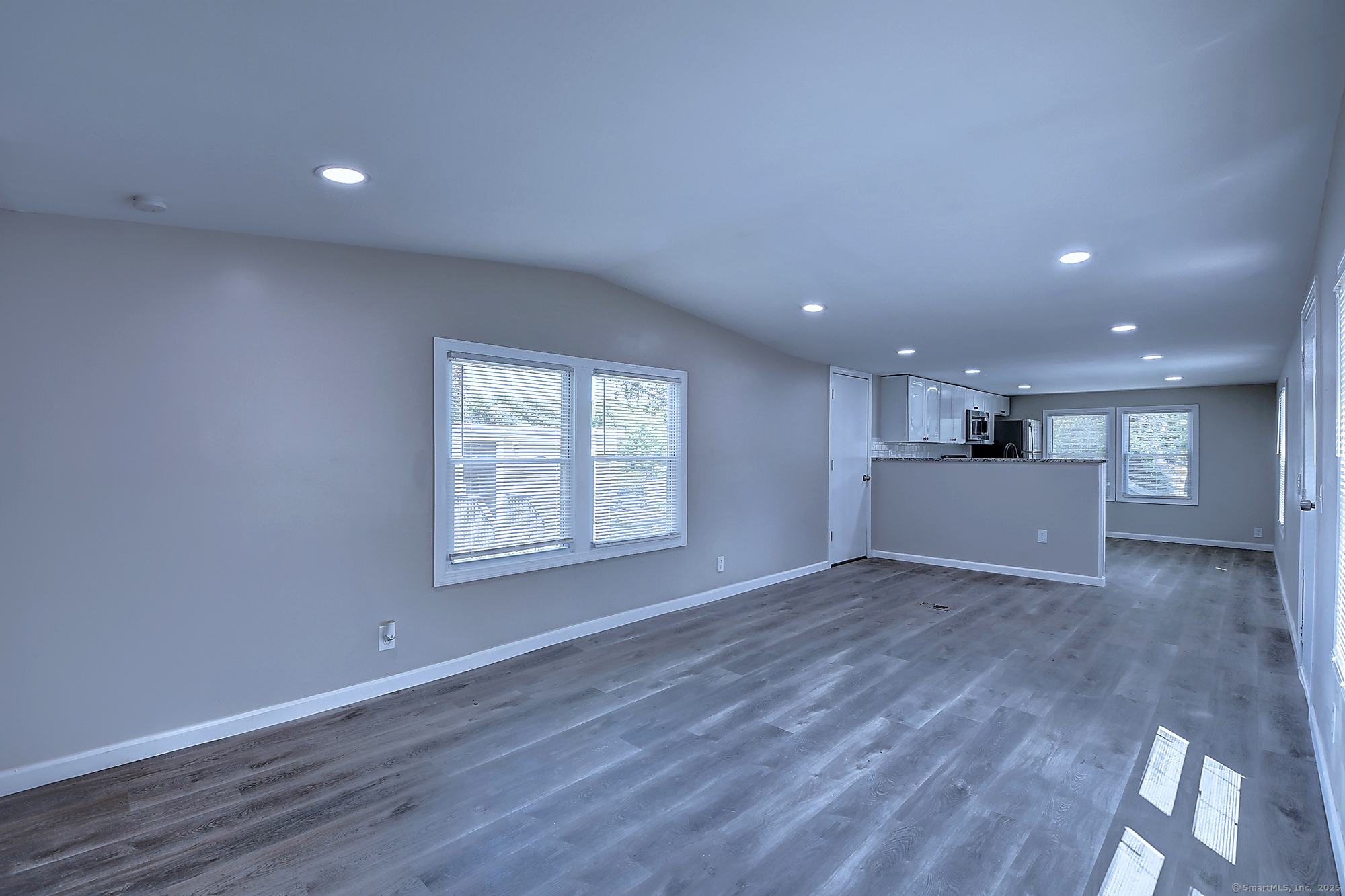 66 Nancy Lane Naugatuck, CT 06770 - Photo 9 of 25 a view of an empty room with wooden floor and a window
