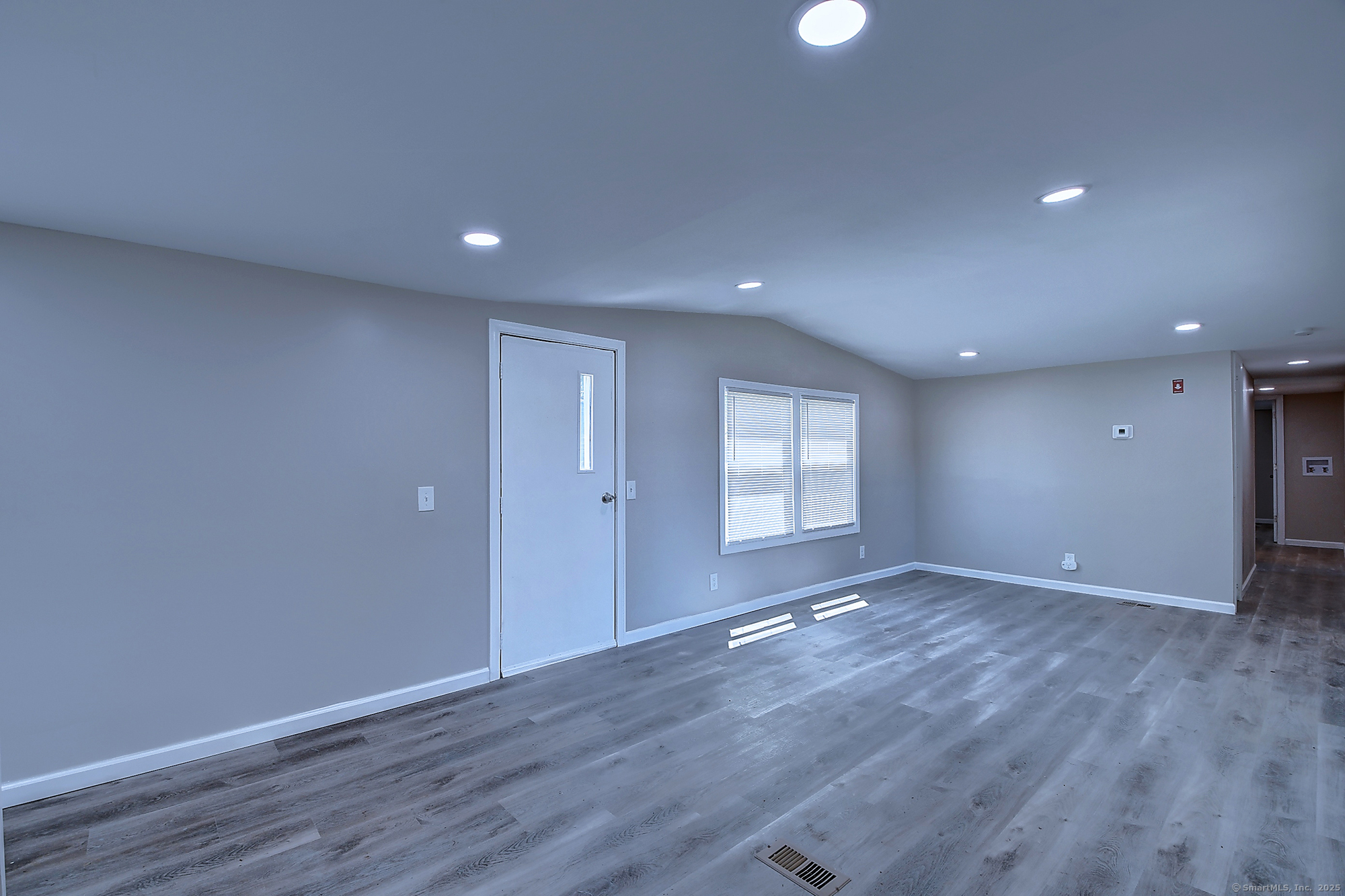 66 Nancy Lane Naugatuck, CT 06770 - Photo 10 of 25 a view of an empty room with wooden floor