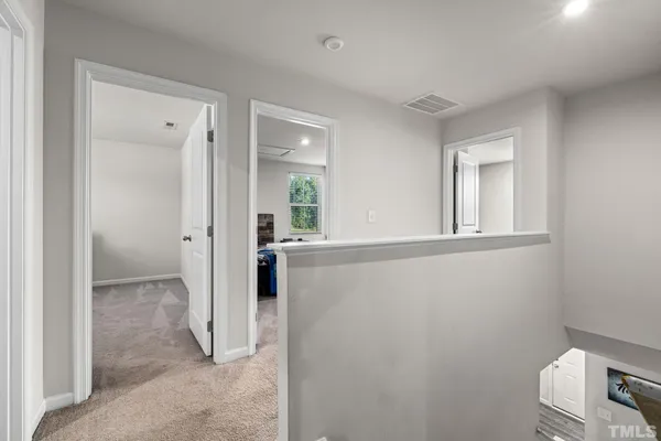 a view of a bathroom from a hallway