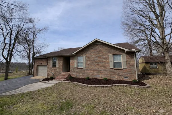 a front view of a house with yard
