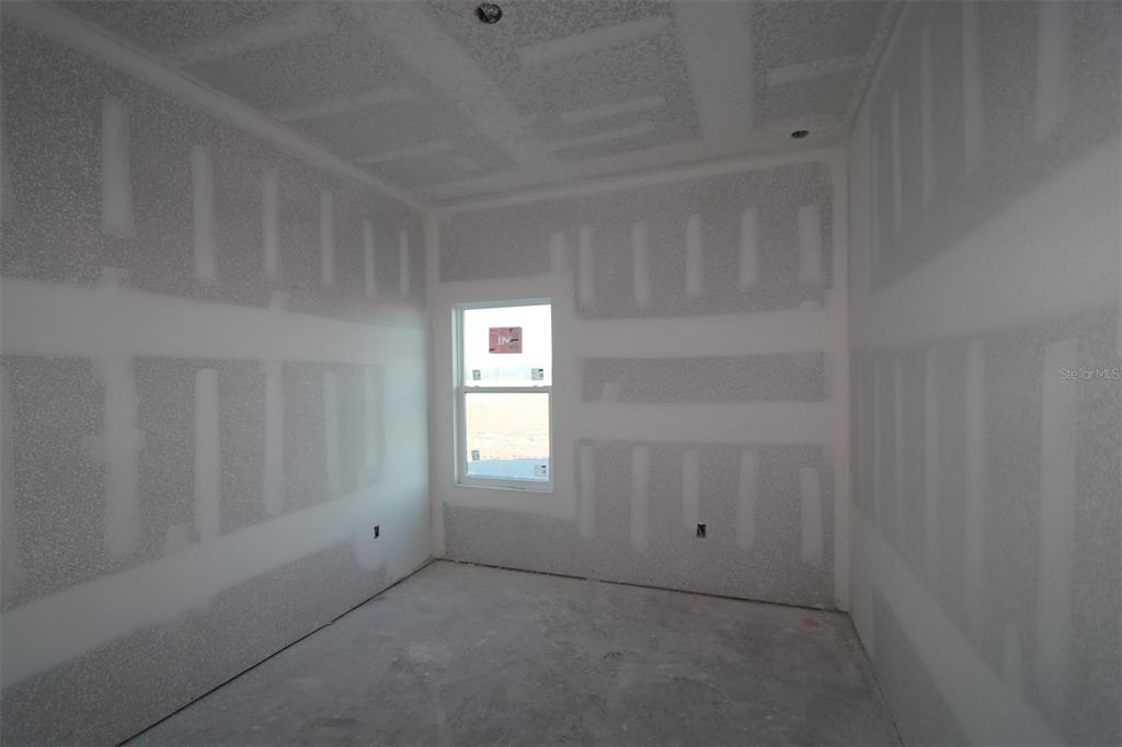 17972 Foxtail Loop Venice, FL 34293 - Photo 11 of 15 a view of an empty room and a window