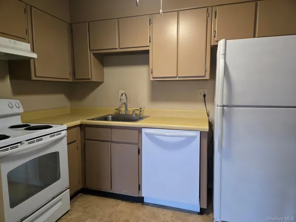 a view of a livingroom with a kitchen