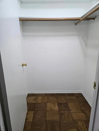 a kitchen with sink a stove and cabinets
