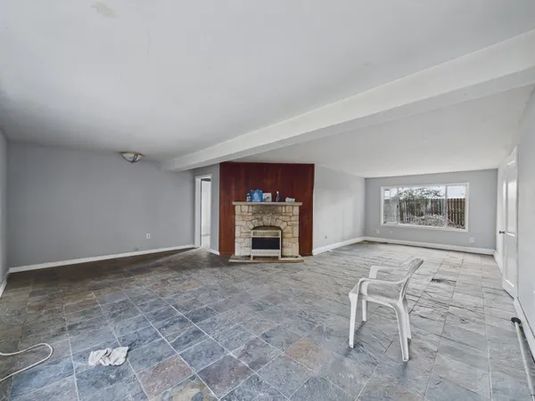 a view of a livingroom with furniture and a fireplace