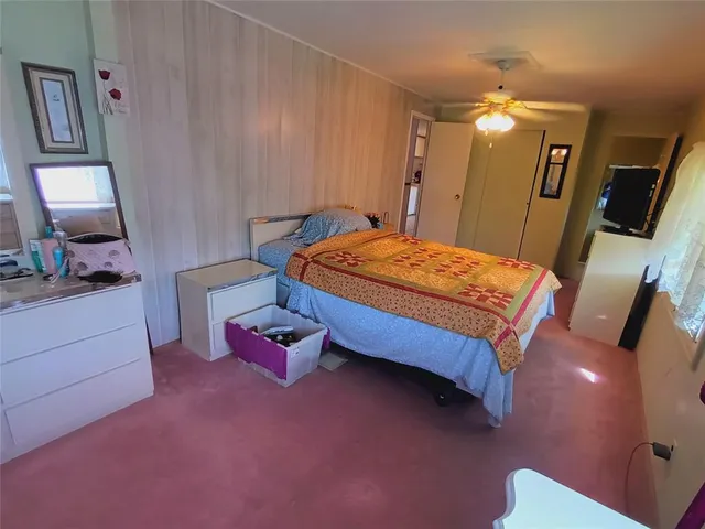 a kitchen with a stove top oven and refrigerator