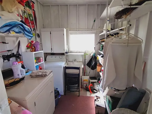 a kitchen with stainless steel appliances a refrigerator sink and cabinets