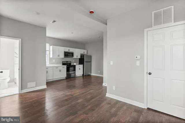 a view of kitchen with wooden floor