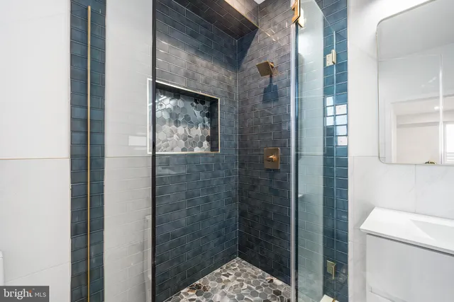 a bathroom with a small shower