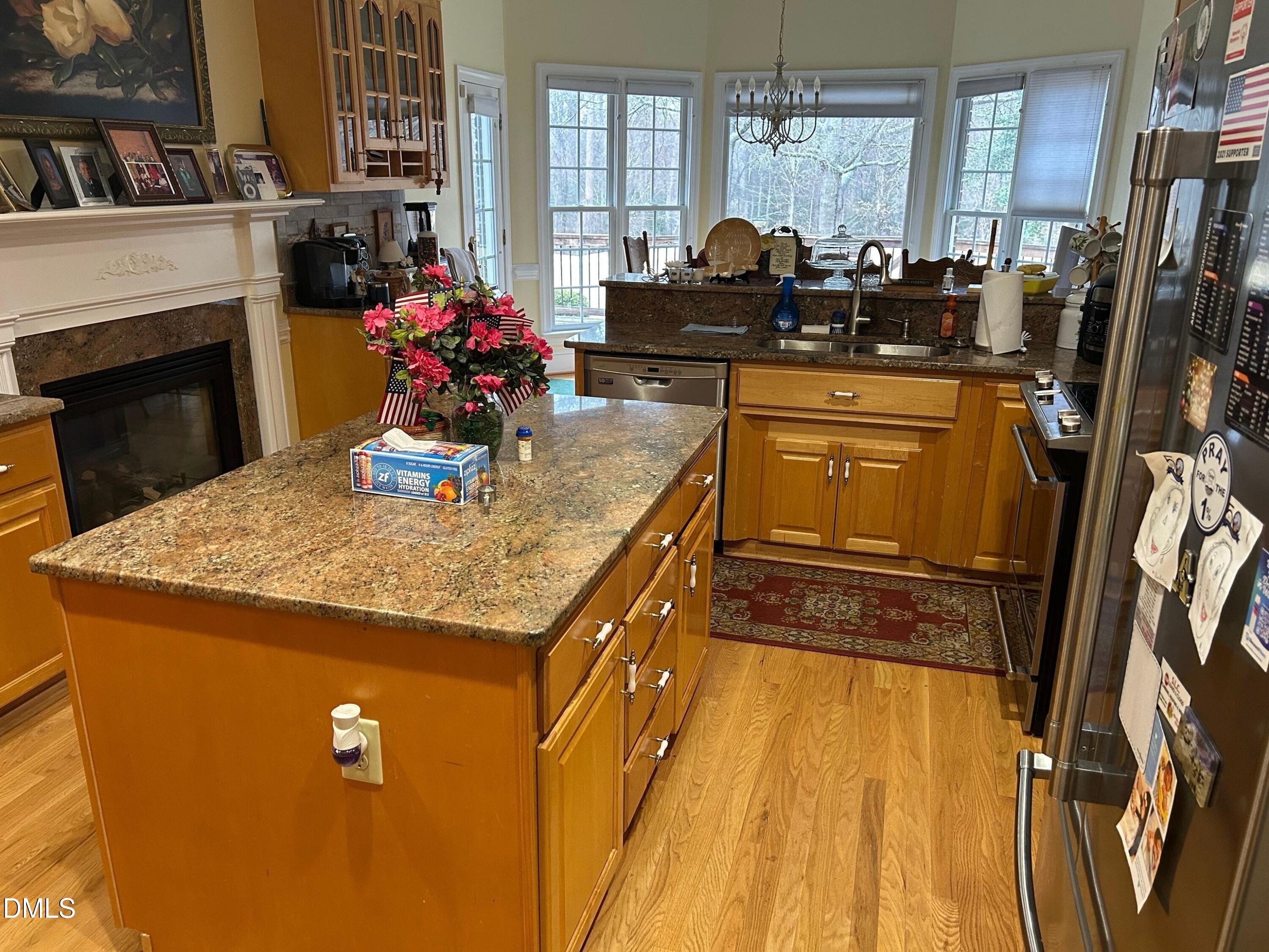 3608 Pauley Court Raleigh, NC 27610 - Photo 16 of 48 a kitchen with sink a refrigerator and window
