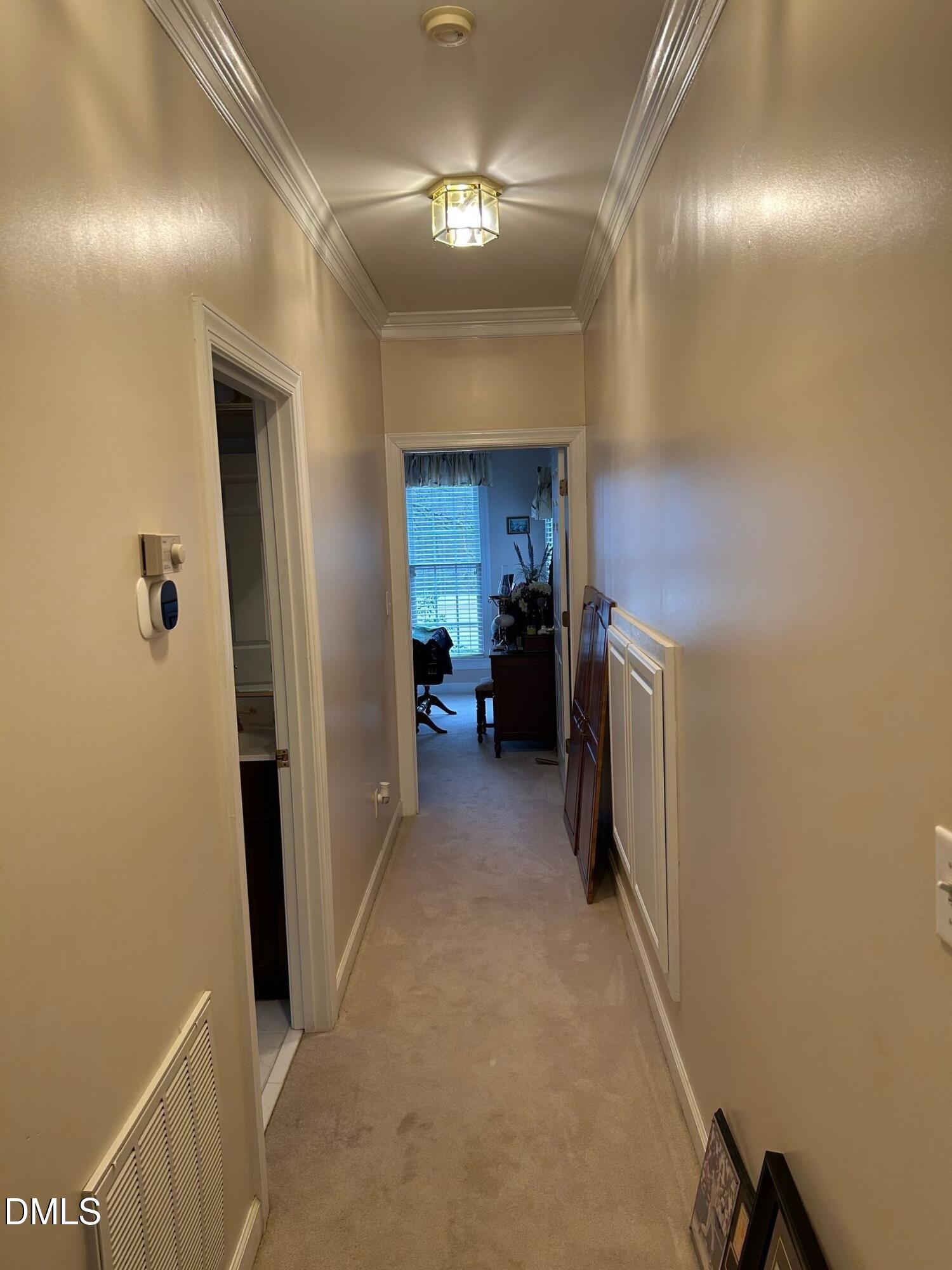 3608 Pauley Court Raleigh, NC 27610 - Photo 22 of 48 a view of a hallway to a livingroom and a bathroom