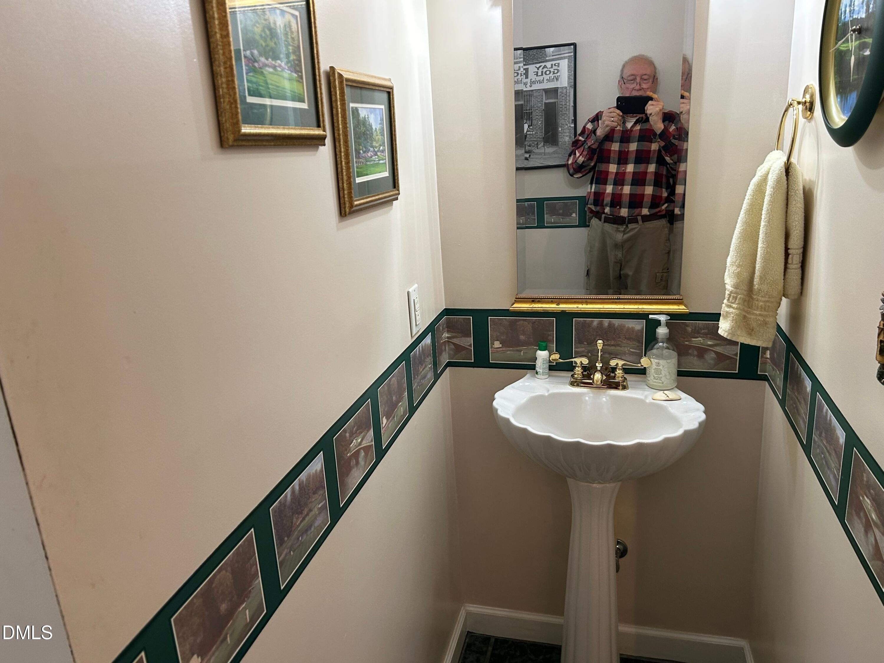 3608 Pauley Court Raleigh, NC 27610 - Photo 24 of 48 a bathroom with a sink and a mirror
