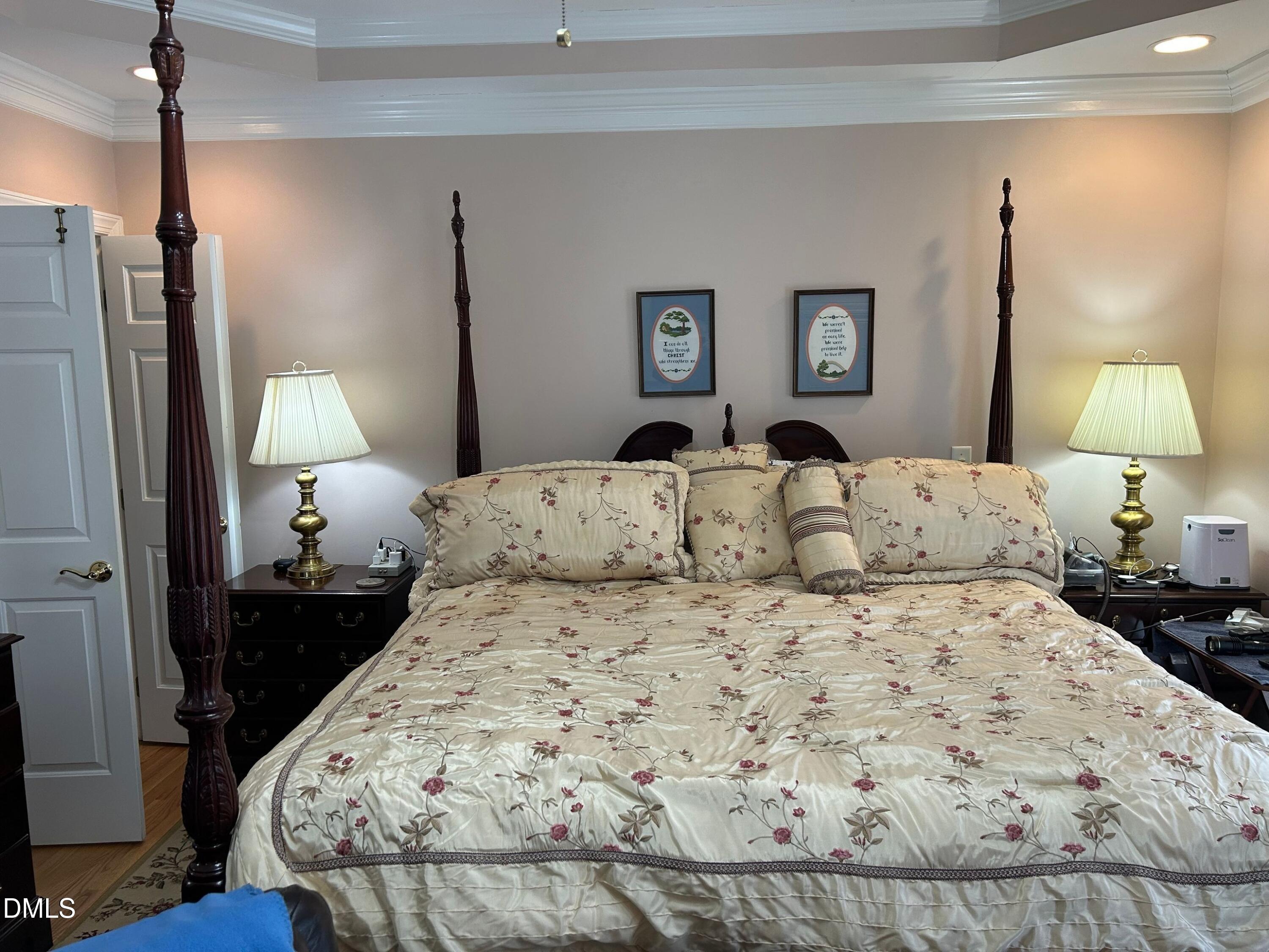 3608 Pauley Court Raleigh, NC 27610 - Photo 27 of 48 a bedroom with a bed and a lamp