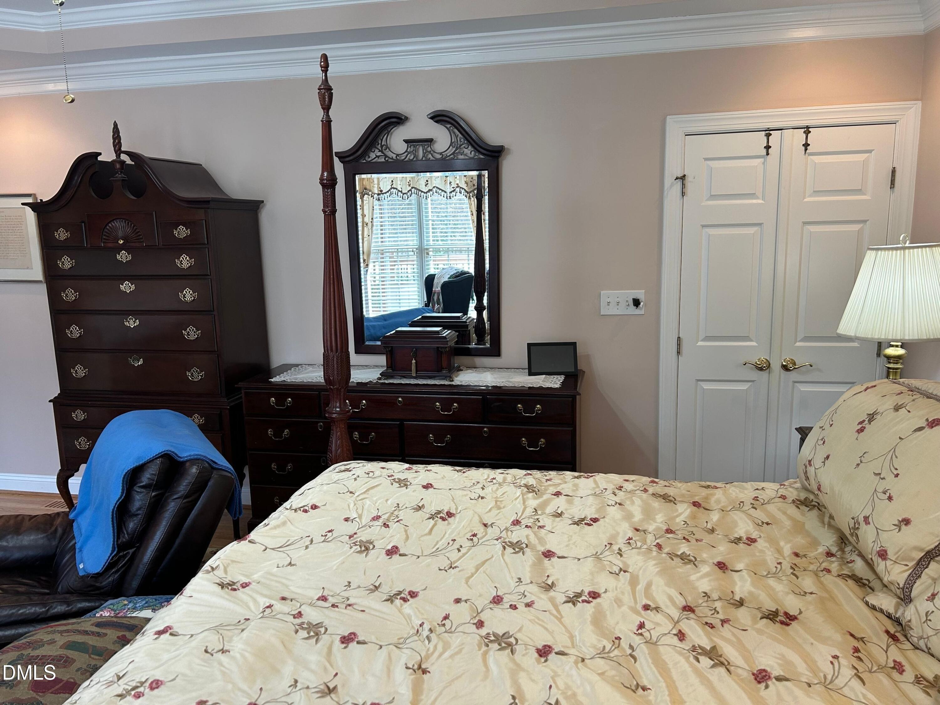 3608 Pauley Court Raleigh, NC 27610 - Photo 28 of 48 a bedroom with a bed and a mirror on dresser
