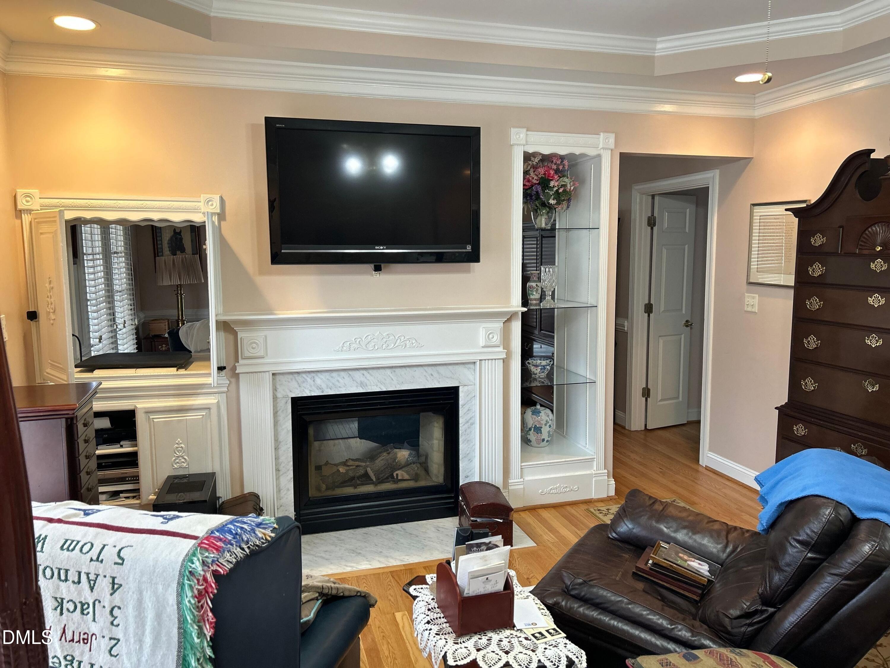 3608 Pauley Court Raleigh, NC 27610 - Photo 29 of 48 a living room with furniture fireplace and flat screen tv