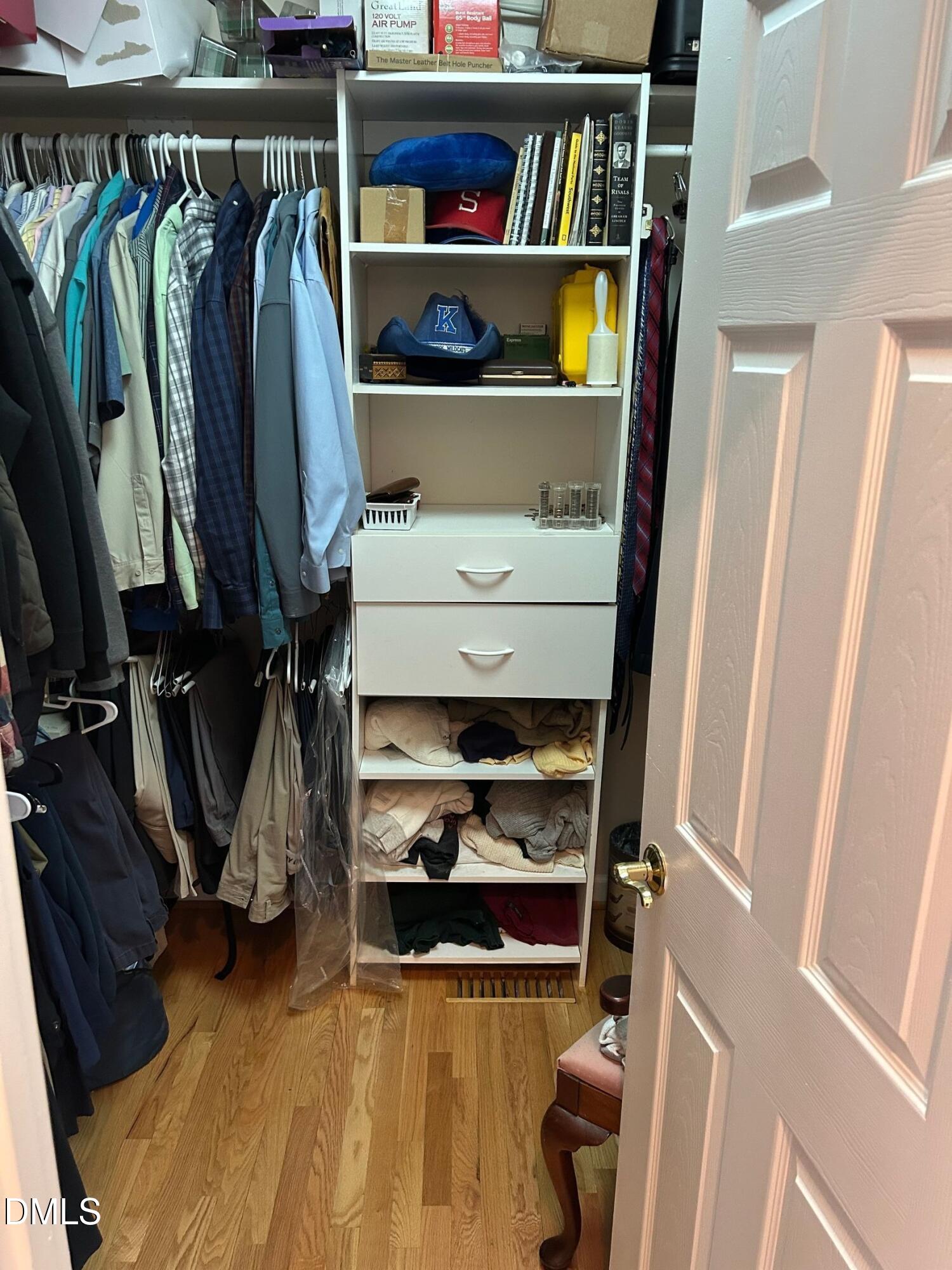 3608 Pauley Court Raleigh, NC 27610 - Photo 30 of 48 a view of walk in closet with clothes and shoes