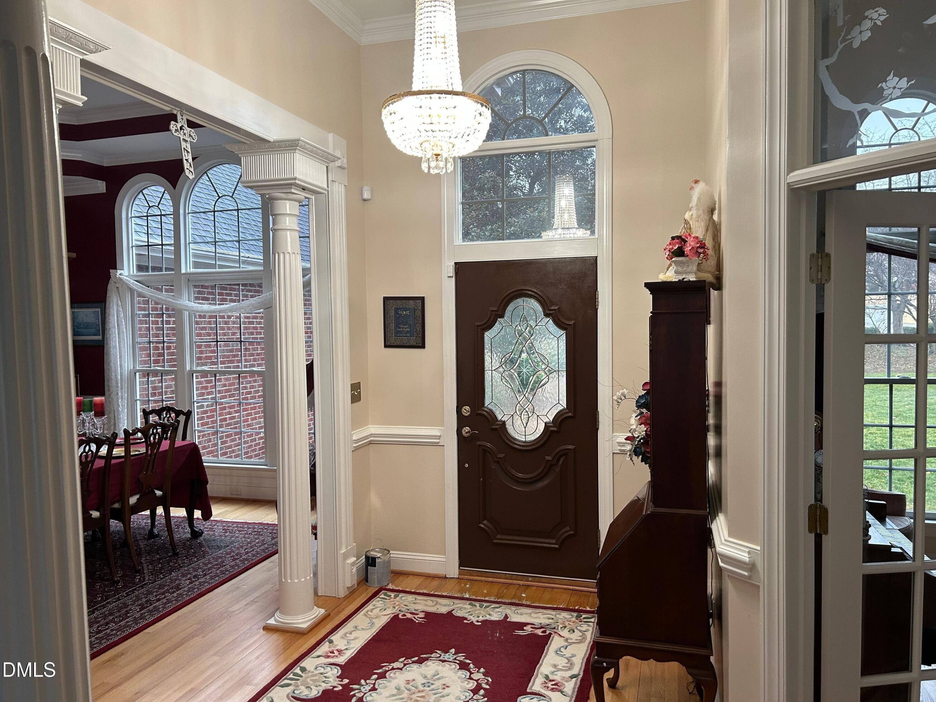 3608 Pauley Court Raleigh, NC 27610 - Photo 3 of 48 a living room with furniture a fireplace and a table