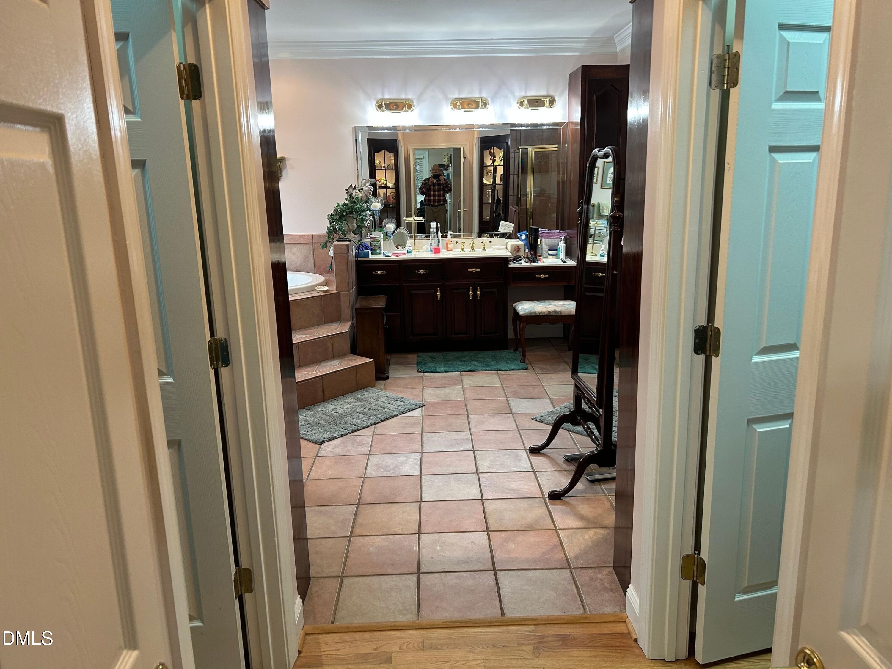 3608 Pauley Court Raleigh, NC 27610 - Photo 32 of 48 a bathroom with shower and mirror