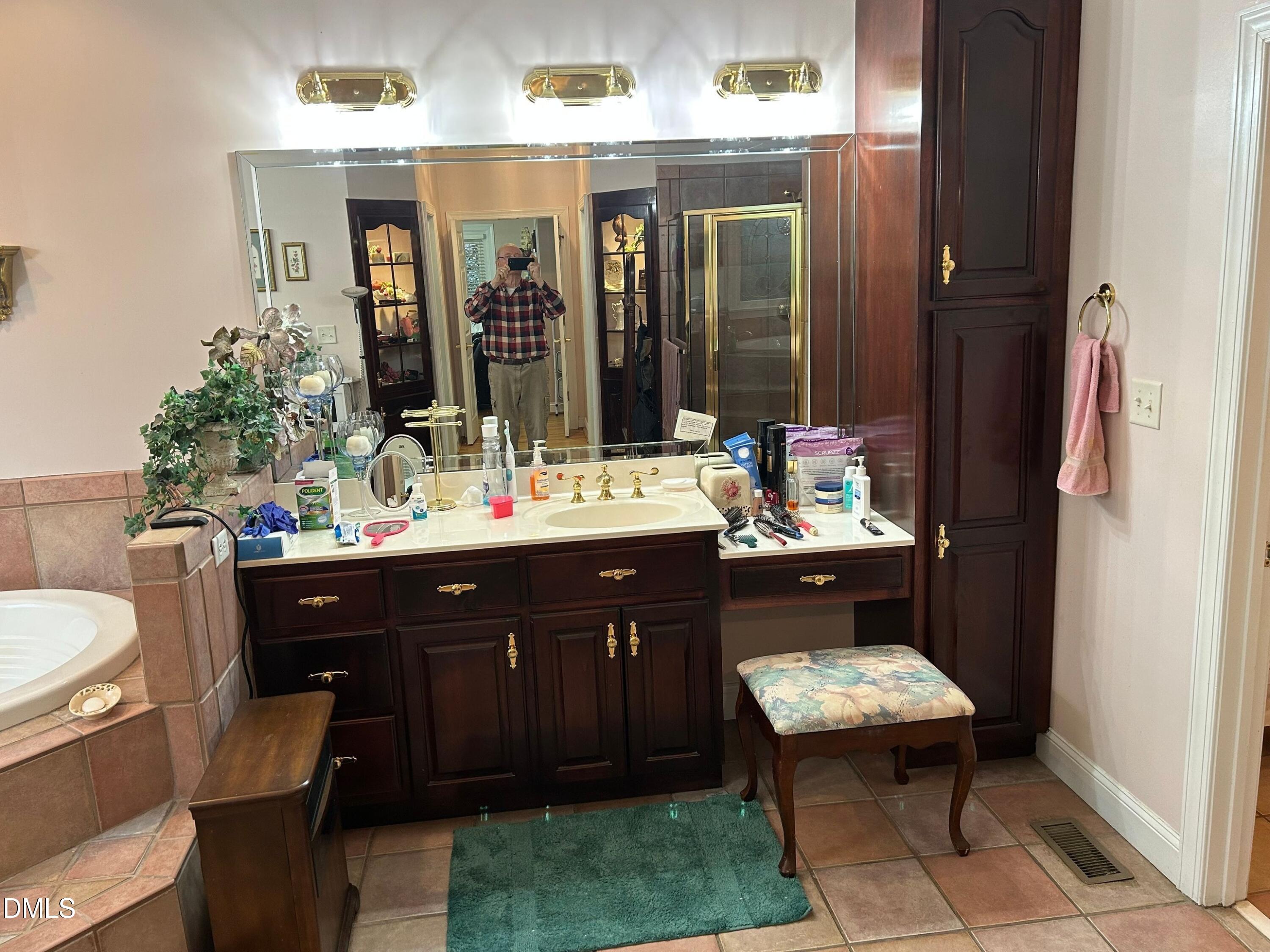 3608 Pauley Court Raleigh, NC 27610 - Photo 34 of 48 a bathroom with a sink double vanity and a mirror
