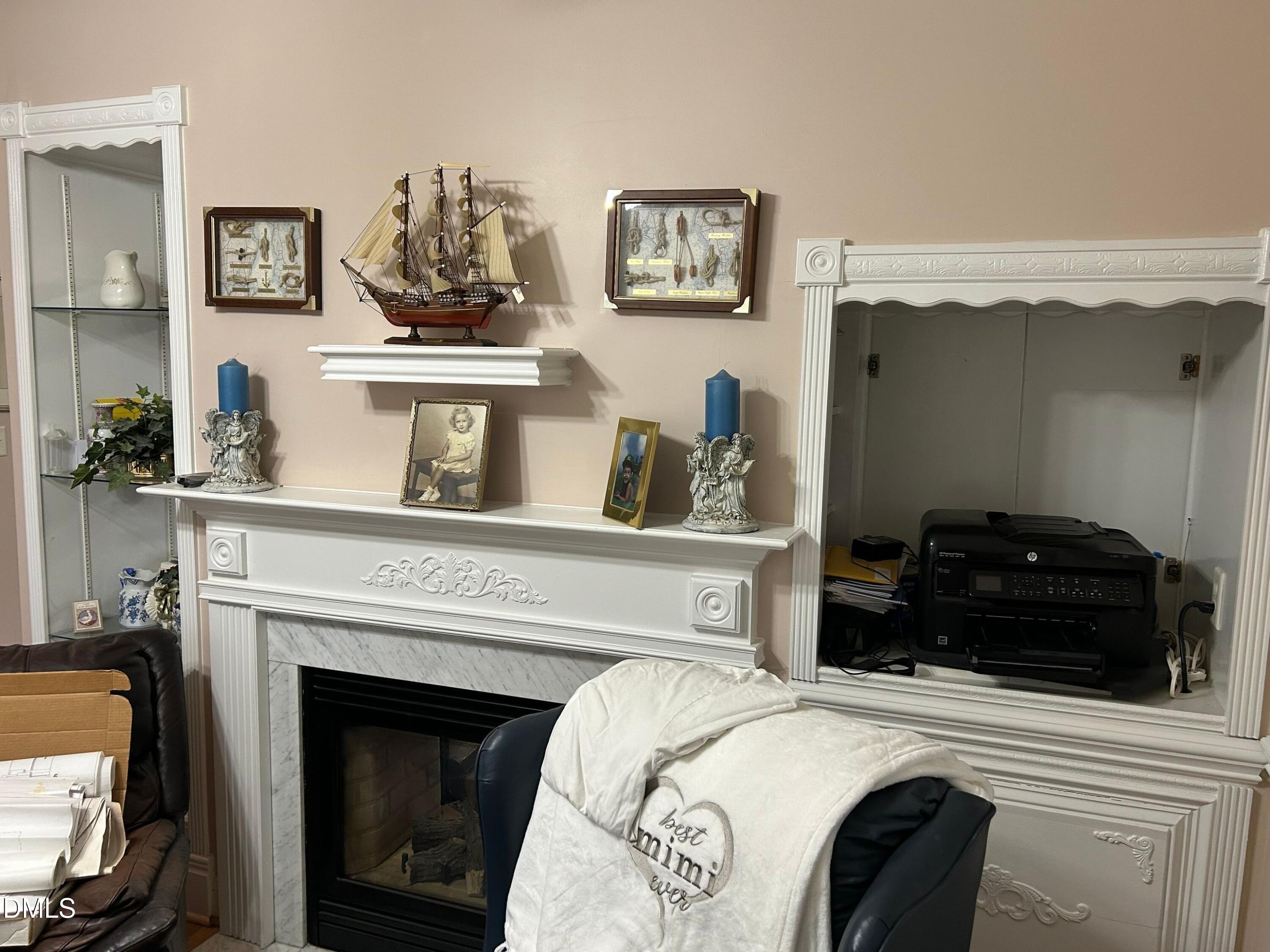 3608 Pauley Court Raleigh, NC 27610 - Photo 37 of 48 a bedroom with a bed and a fireplace