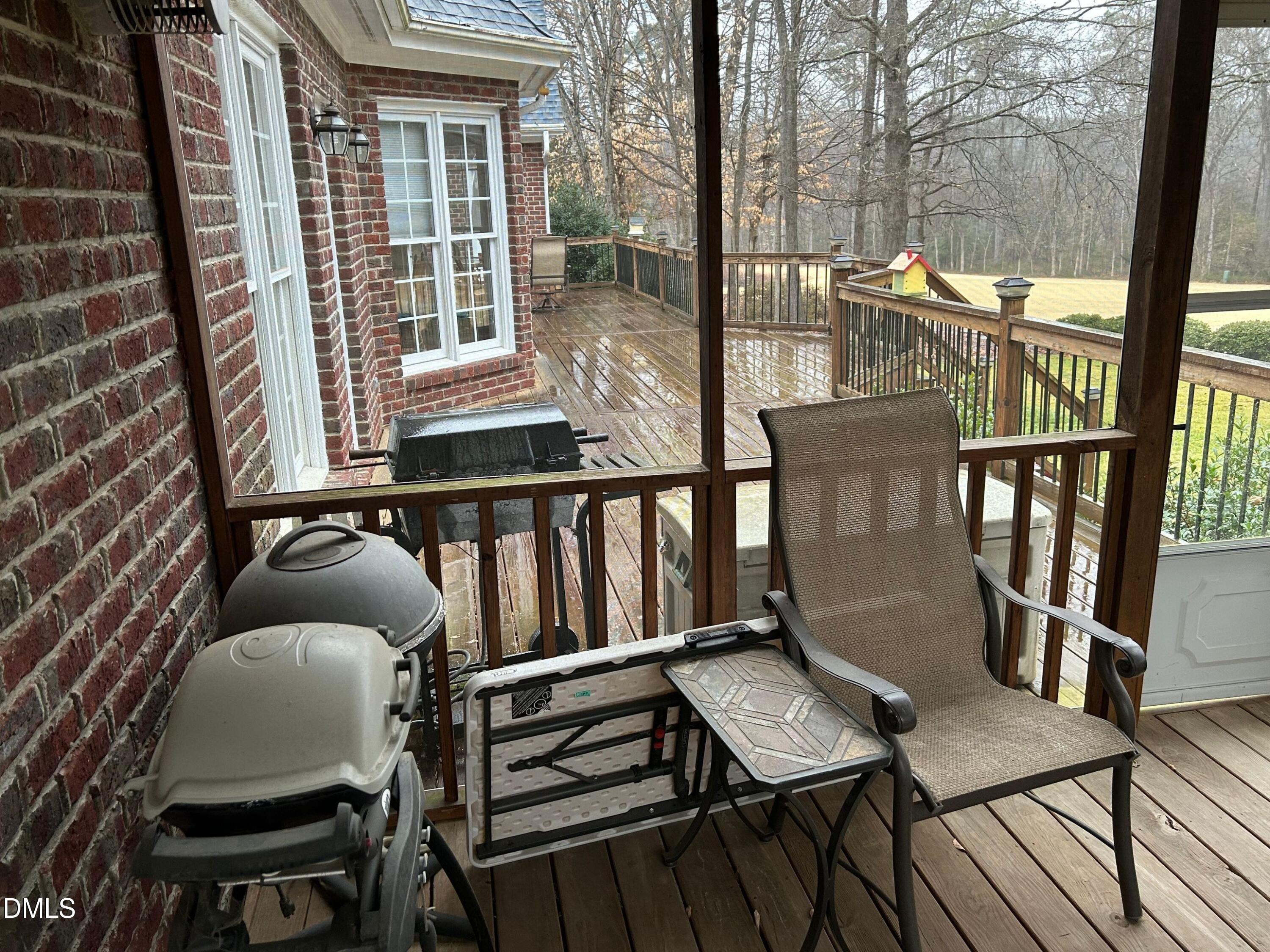 3608 Pauley Court Raleigh, NC 27610 - Photo 40 of 48 a balcony with table and chairs