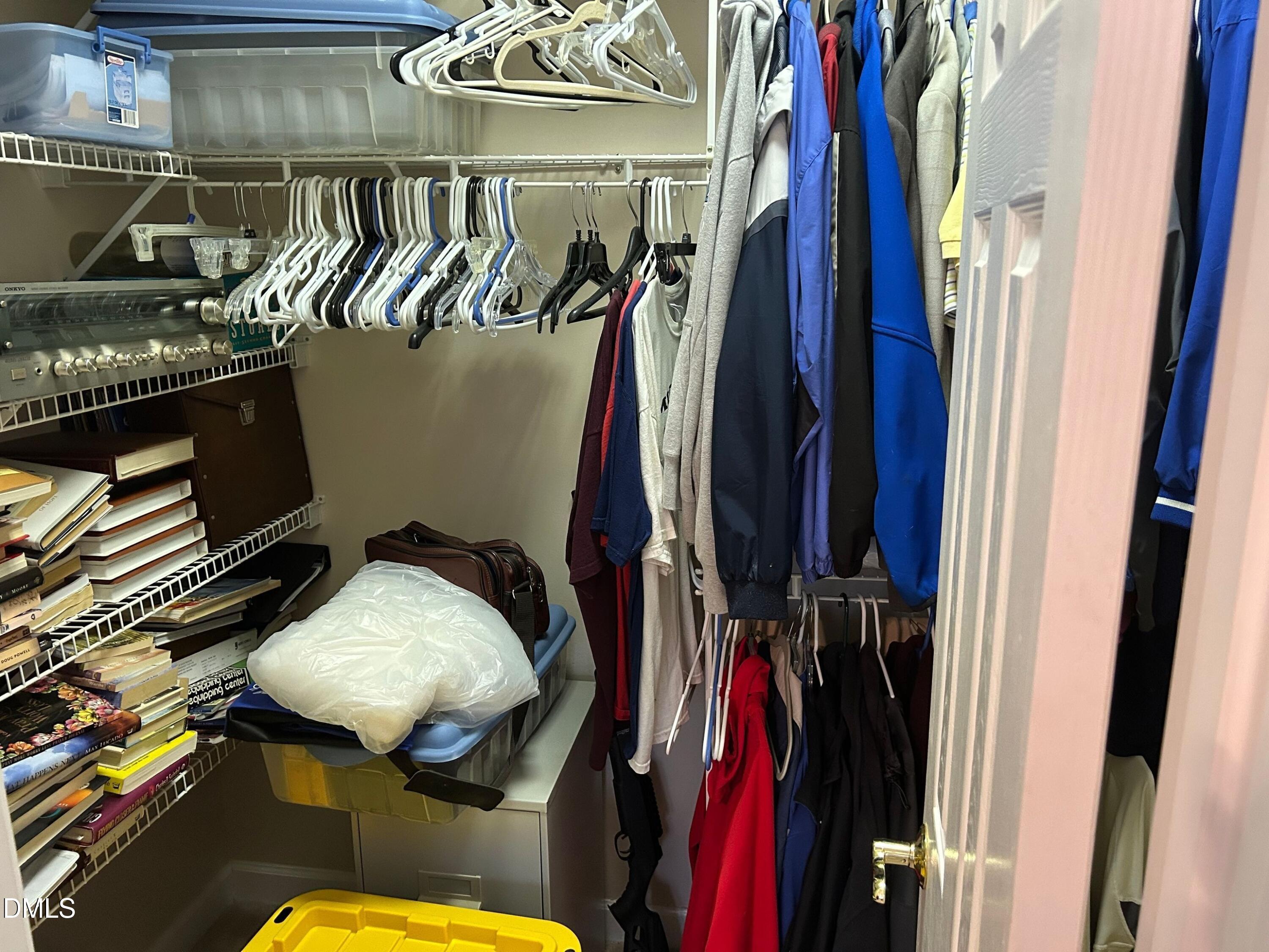3608 Pauley Court Raleigh, NC 27610 - Photo 44 of 48 a view of walk in closet with clothes and shoes