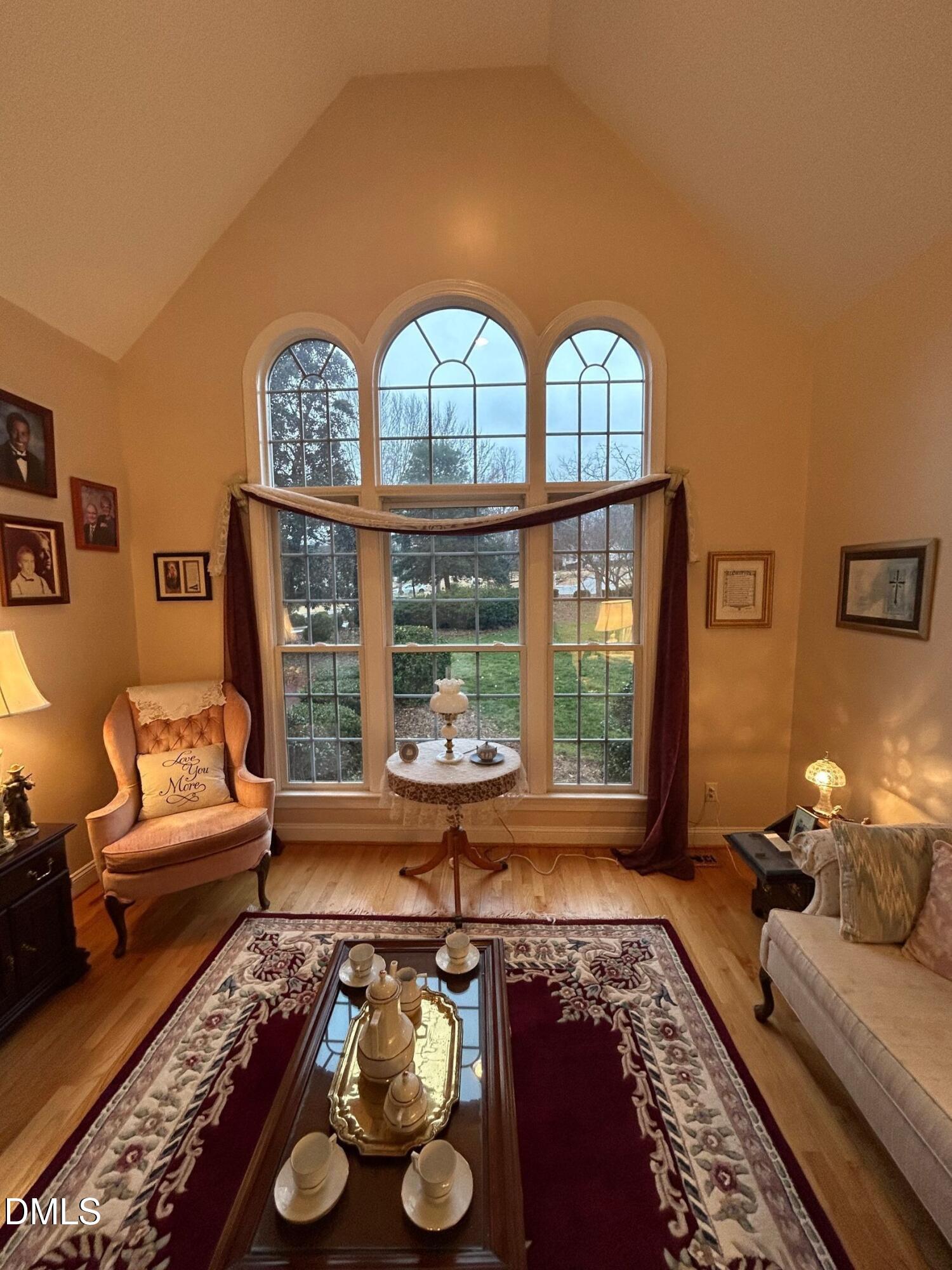 3608 Pauley Court Raleigh, NC 27610 - Photo 7 of 48 a living room with furniture and a large window