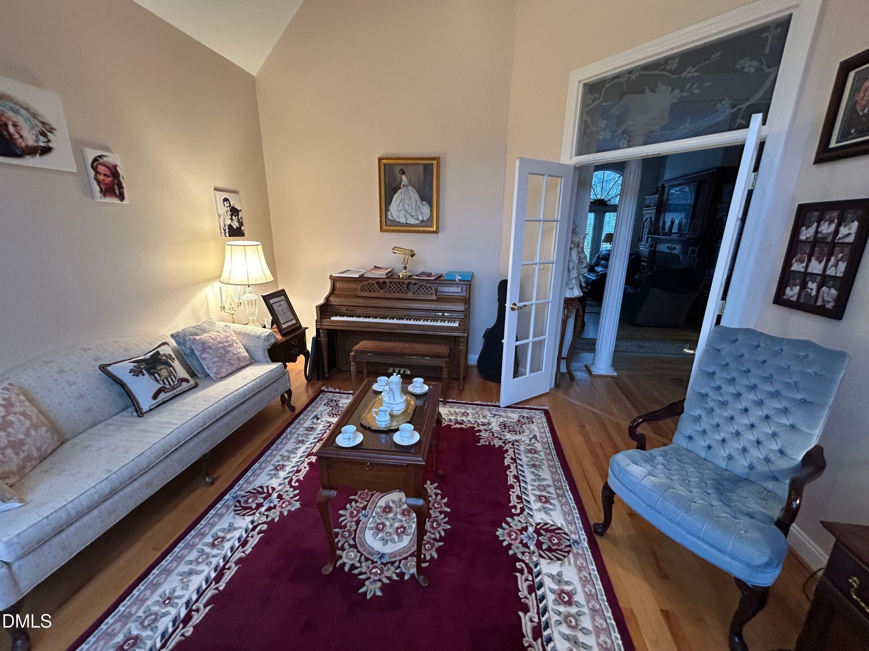 3608 Pauley Court Raleigh, NC 27610 - Photo 8 of 48 a living room with furniture and a rug