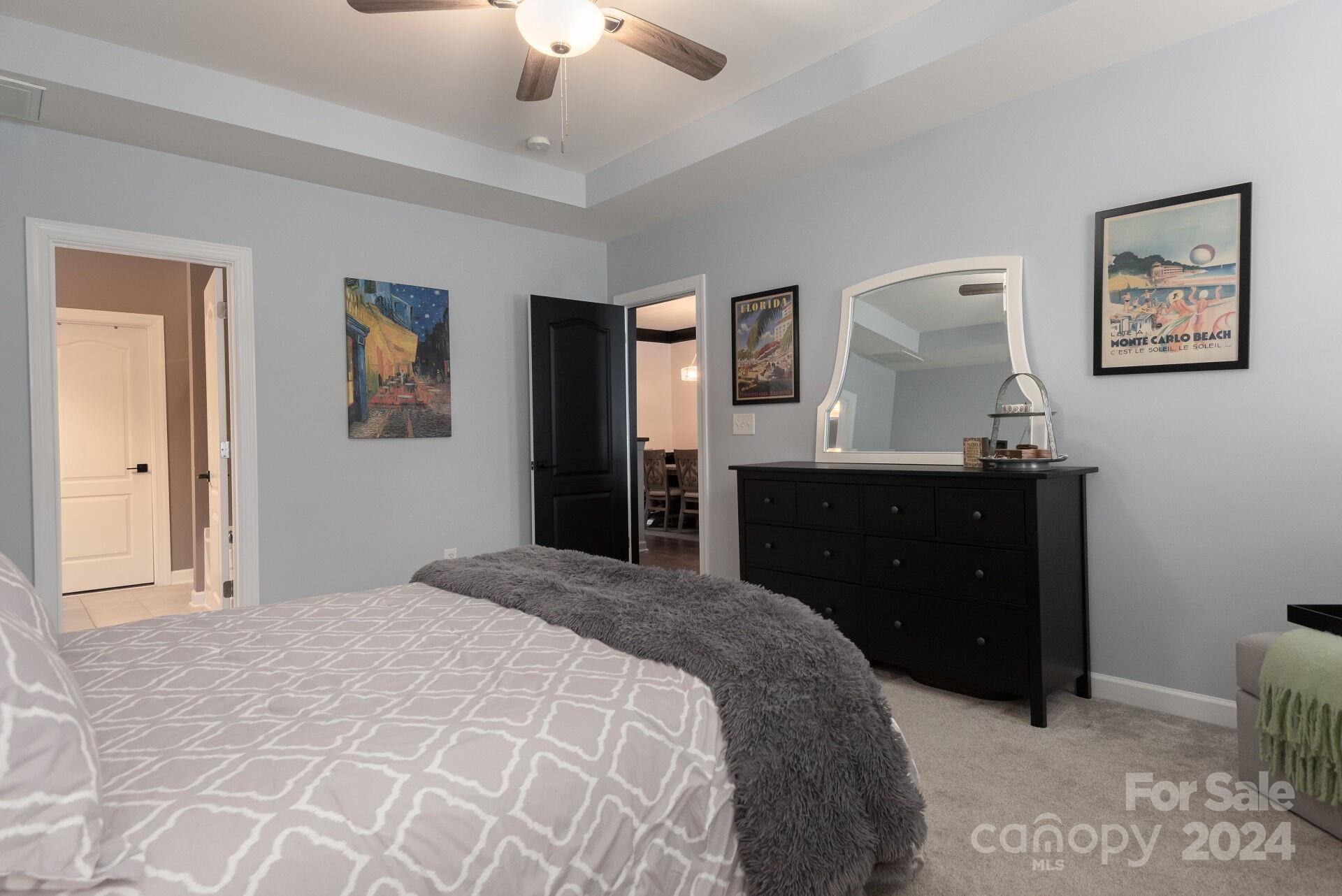 6725 Dusty Saddle Road Charlotte, NC 28277 - Photo 12 of 29 a bedroom with a bed and a dresser