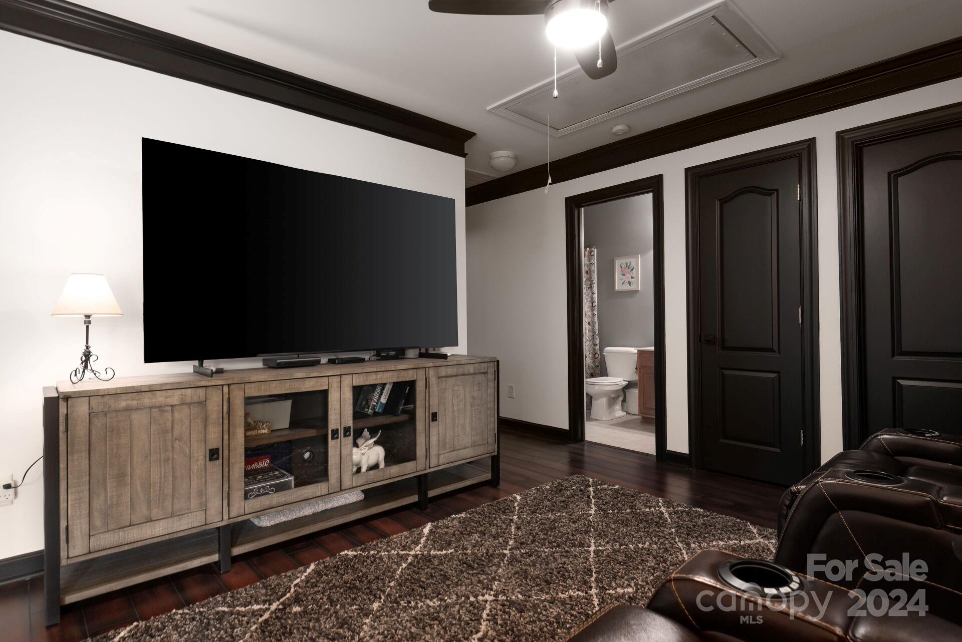 6725 Dusty Saddle Road Charlotte, NC 28277 - Photo 17 of 29 a living room with furniture and a flat screen tv