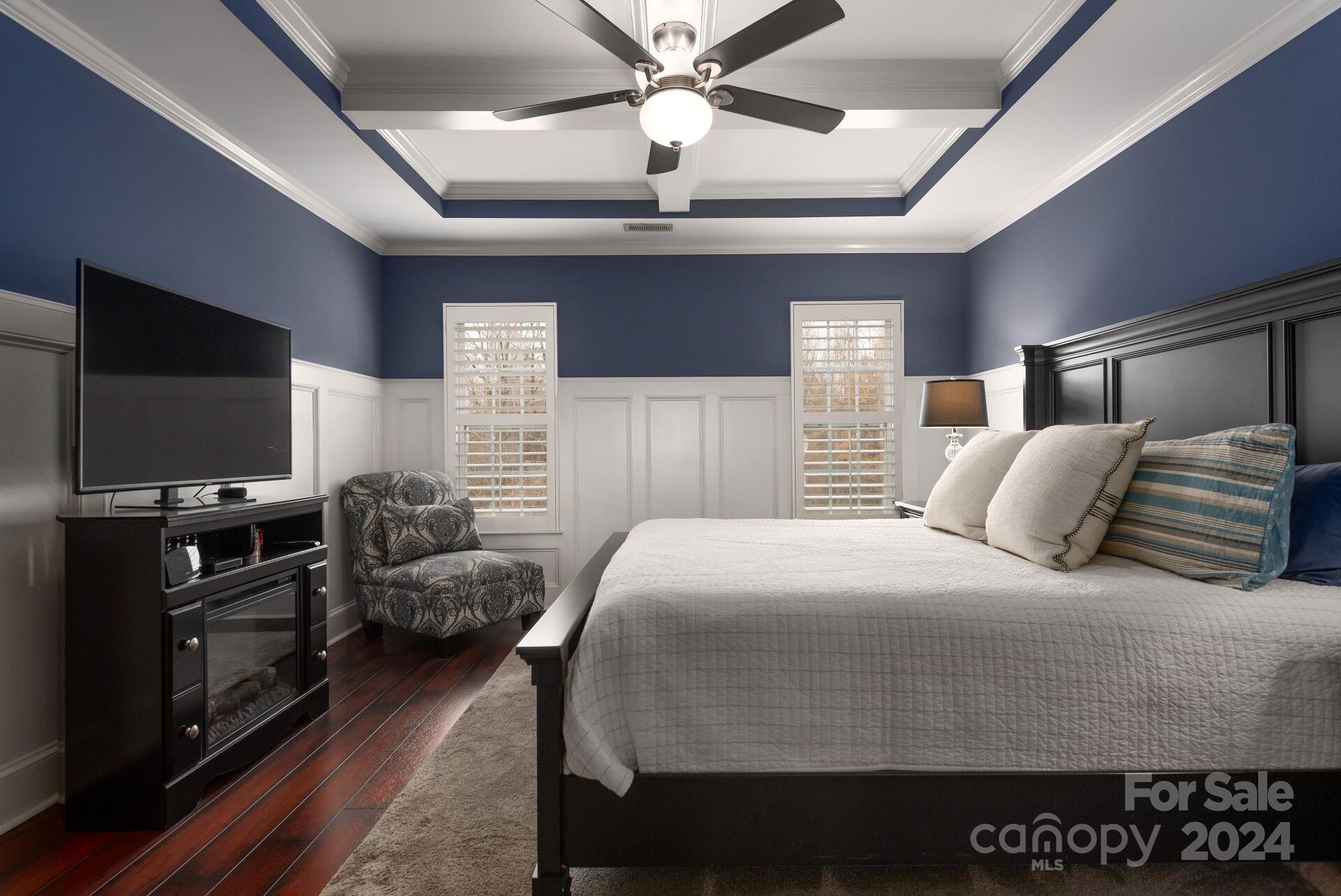 6725 Dusty Saddle Road Charlotte, NC 28277 - Photo 18 of 29 a bedroom with a bed and a flat screen tv