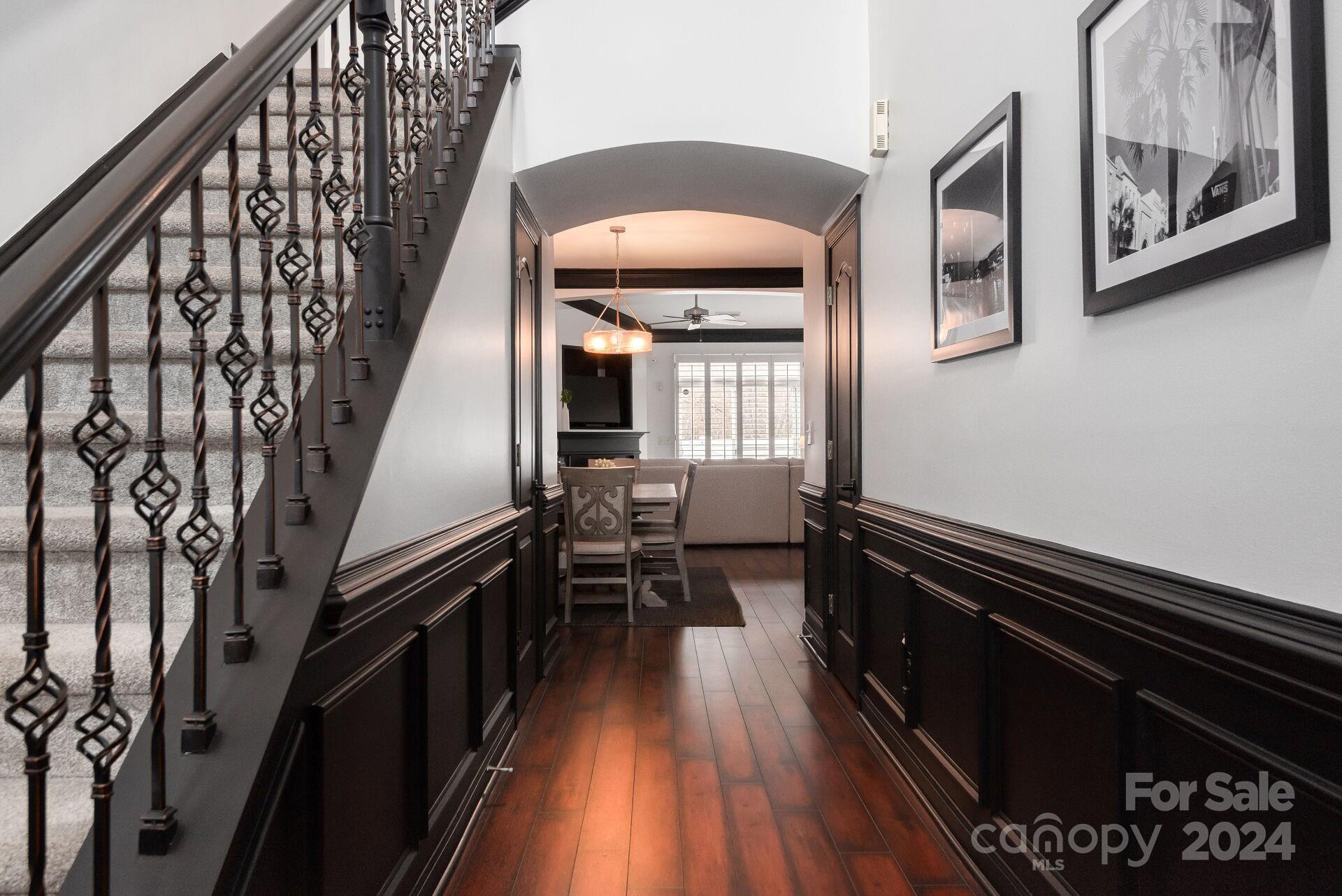 6725 Dusty Saddle Road Charlotte, NC 28277 - Photo 2 of 29 a view of a hallway with wooden floor and staircase