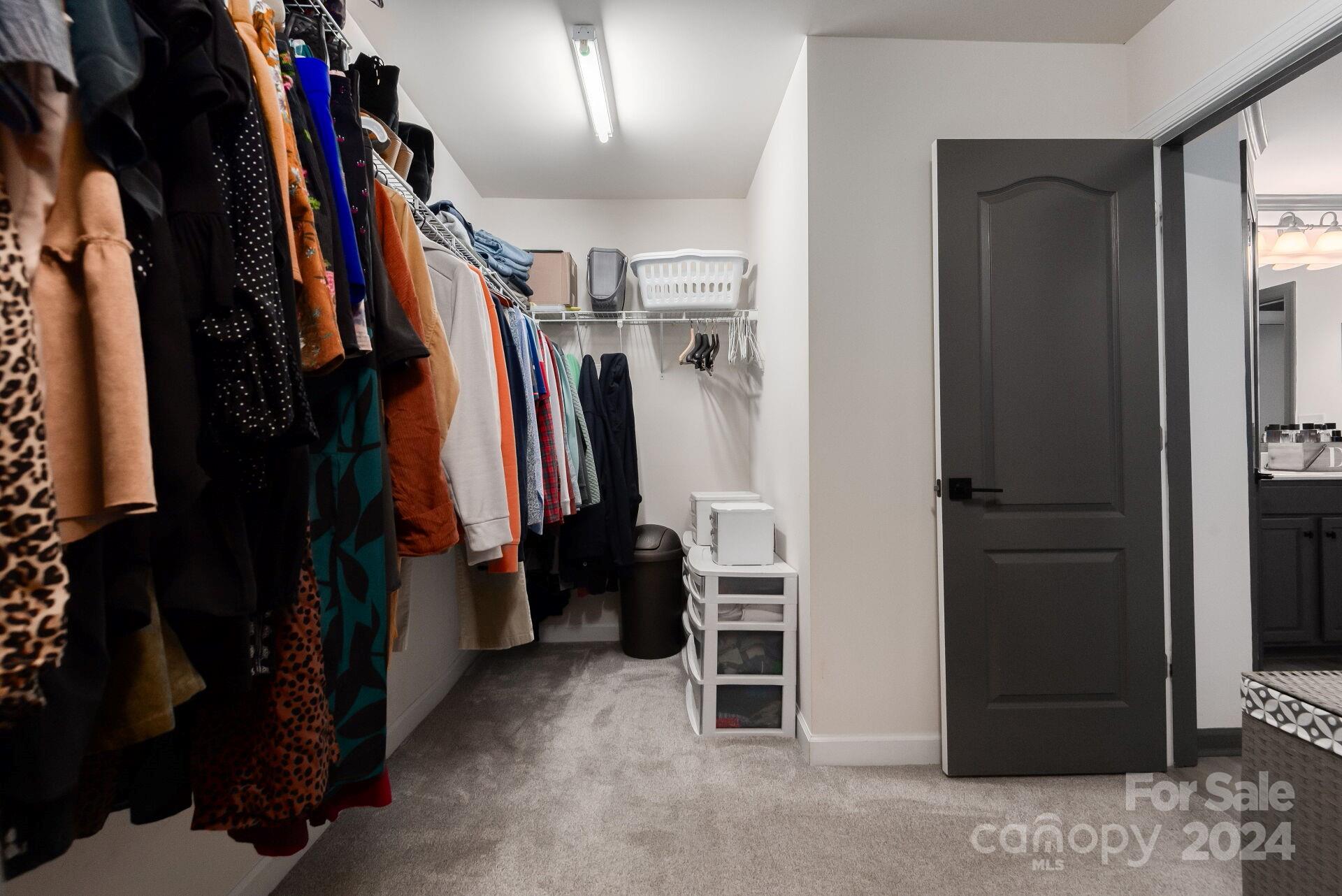 6725 Dusty Saddle Road Charlotte, NC 28277 - Photo 24 of 29 a view of walk in closet with clothes