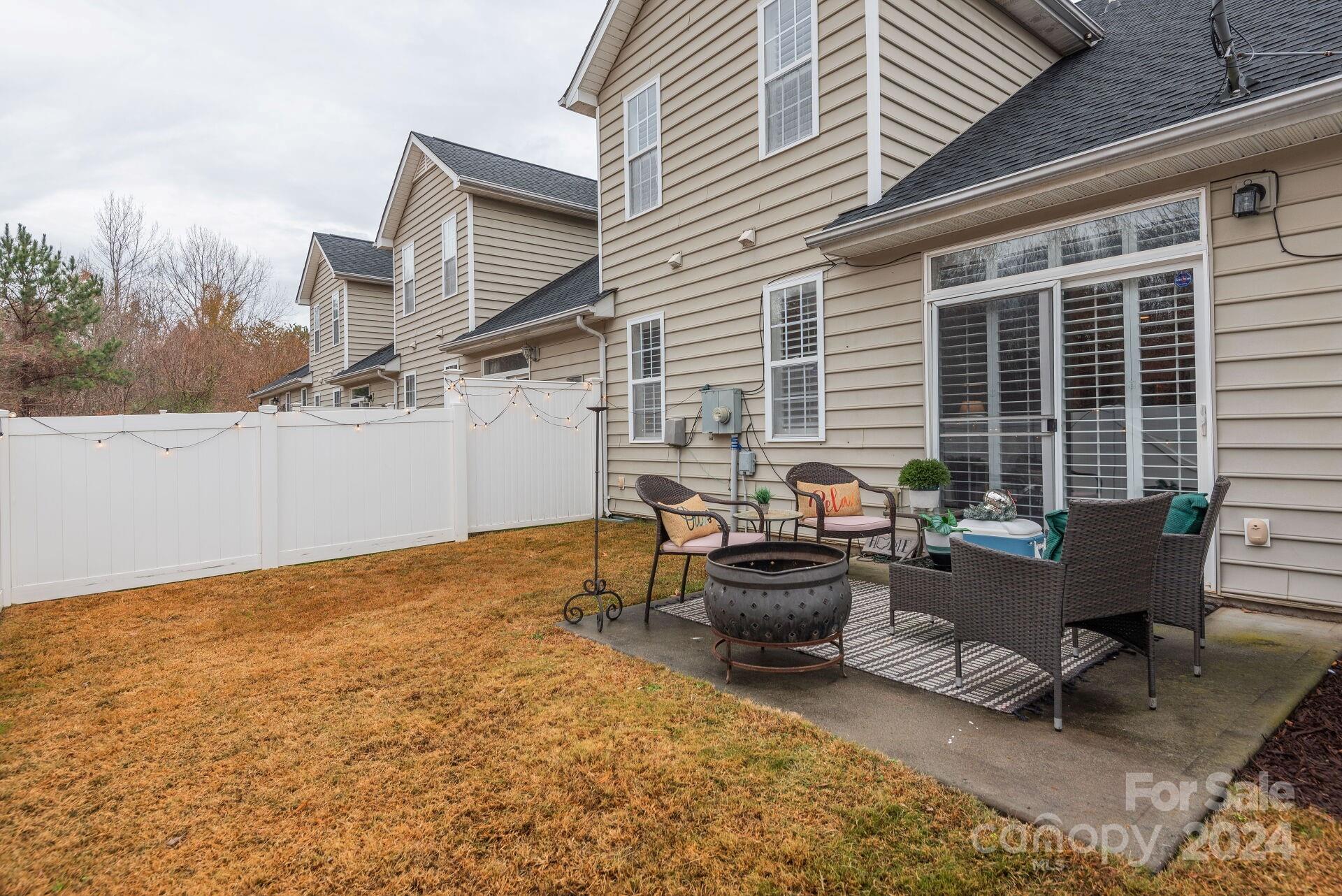 6725 Dusty Saddle Road Charlotte, NC 28277 - Photo 28 of 29 a backyard of a house with outdoor seating