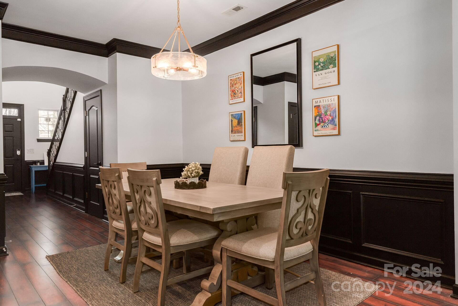 6725 Dusty Saddle Road Charlotte, NC 28277 - Photo 3 of 29 a view of a dining room with furniture and wooden floor