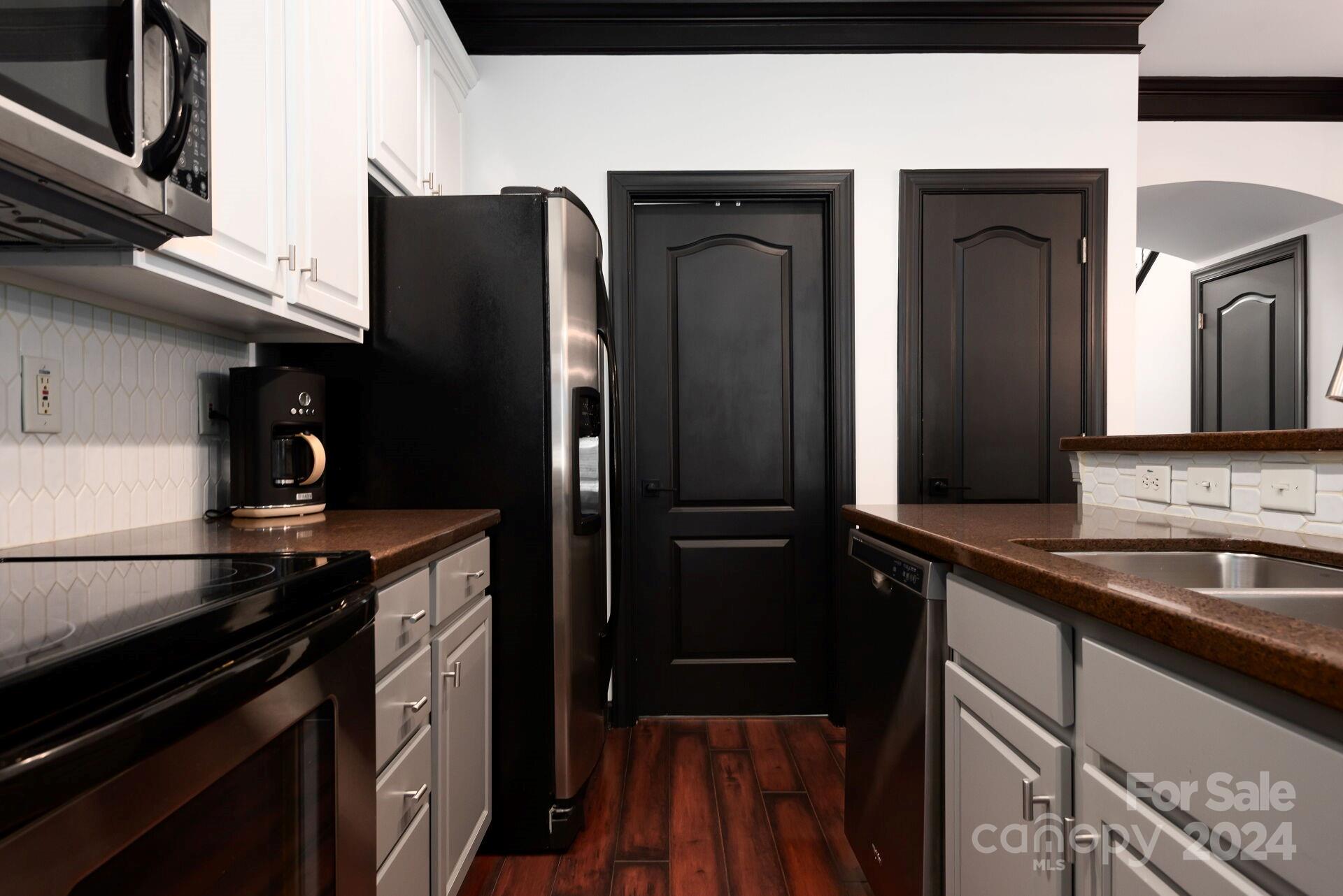 6725 Dusty Saddle Road Charlotte, NC 28277 - Photo 6 of 29 a kitchen with stainless steel appliances granite countertop a refrigerator and a sink