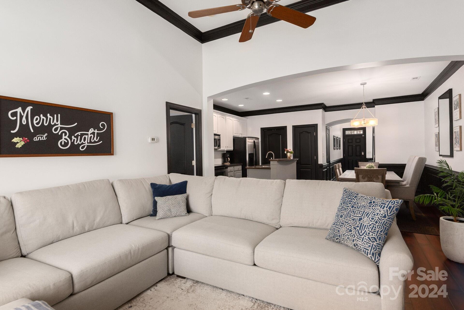 6725 Dusty Saddle Road Charlotte, NC 28277 - Photo 10 of 29 a living room with furniture kitchen view and a large window