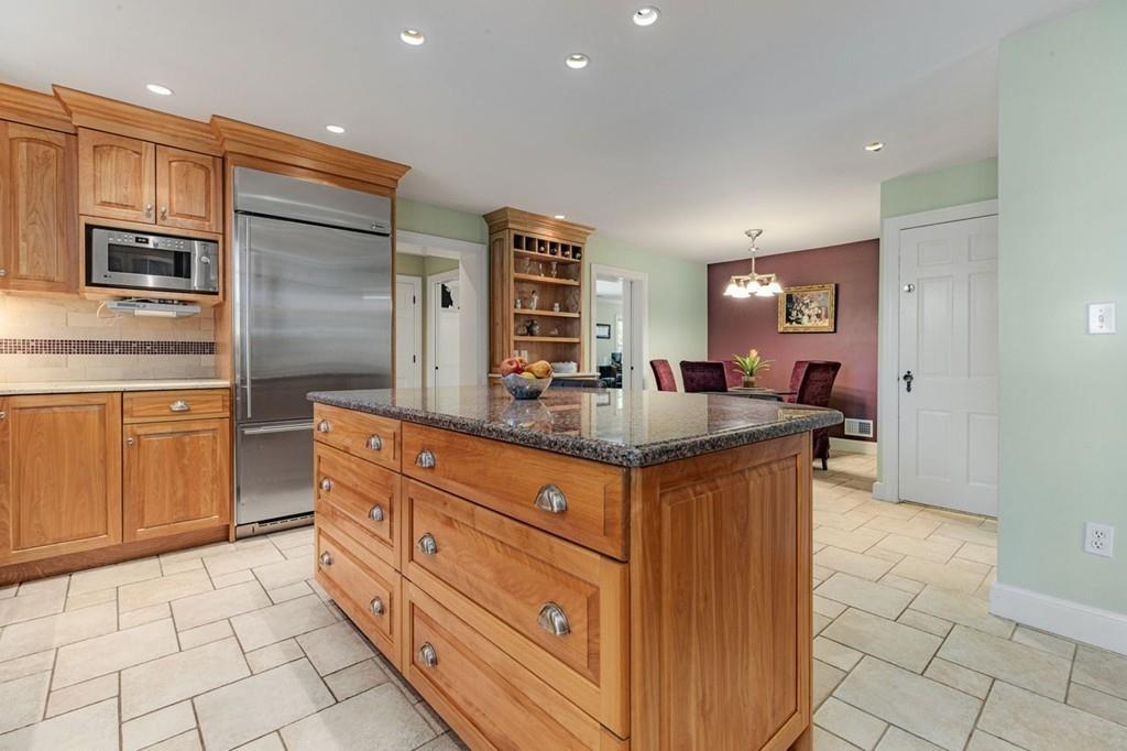 132 Beverly Road Brookline, MA 02467 - Photo 3 of 36 a kitchen with stainless steel appliances granite countertop a sink and cabinets