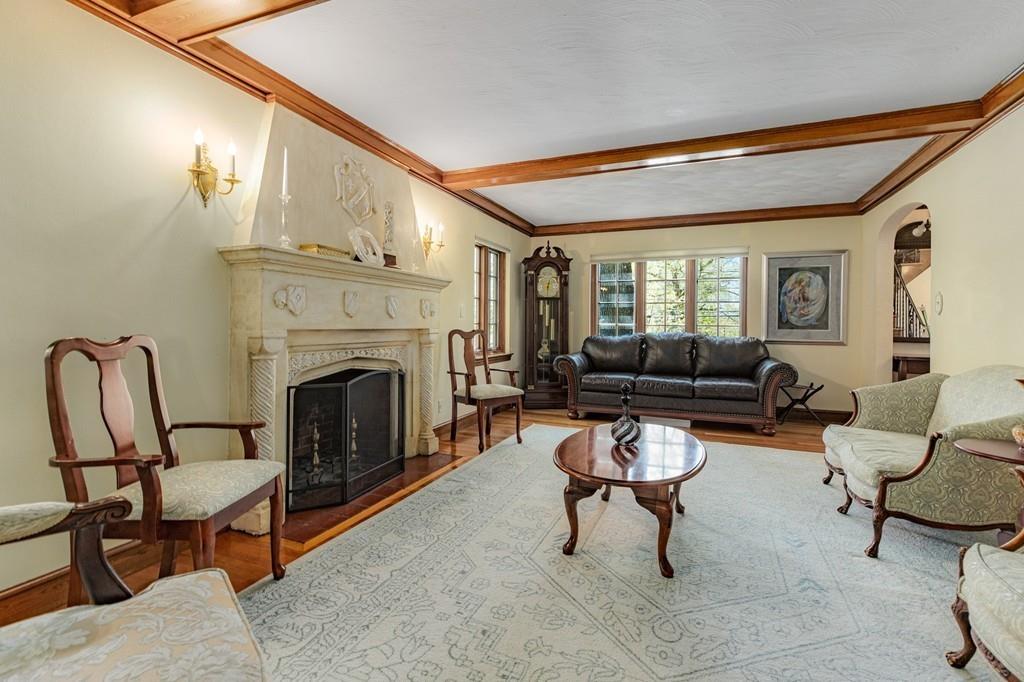 132 Beverly Road Brookline, MA 02467 - Photo 36 of 36 a living room with furniture and a fireplace