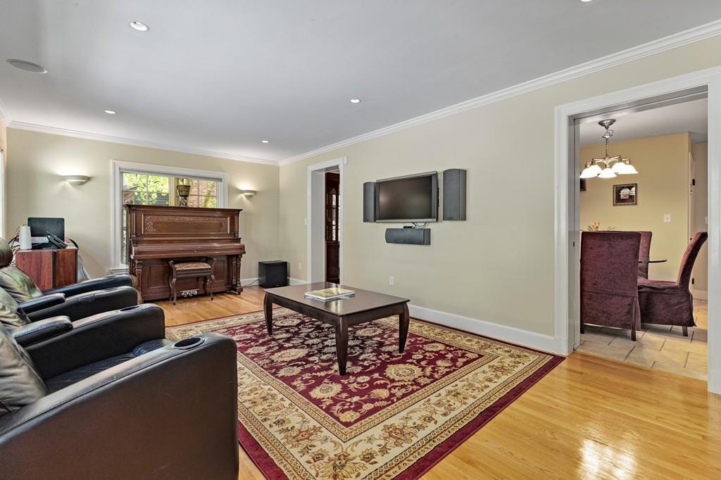 132 Beverly Road Brookline, MA 02467 - Photo 6 of 36 a living room with furniture and a flat screen tv