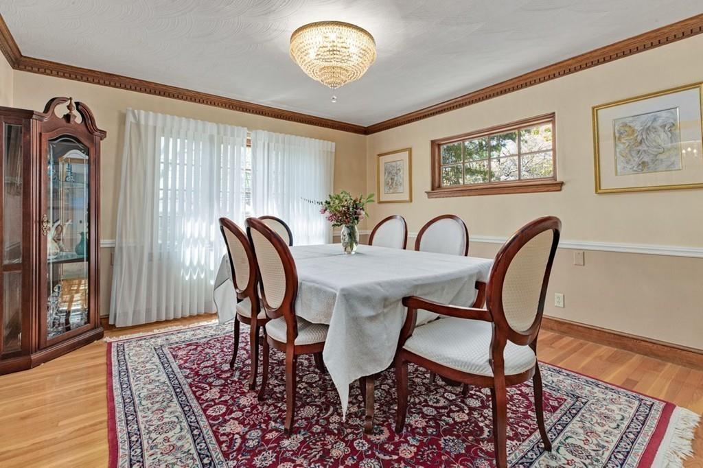 132 Beverly Road Brookline, MA 02467 - Photo 7 of 36 a view of a dining room with furniture window and wooden floor