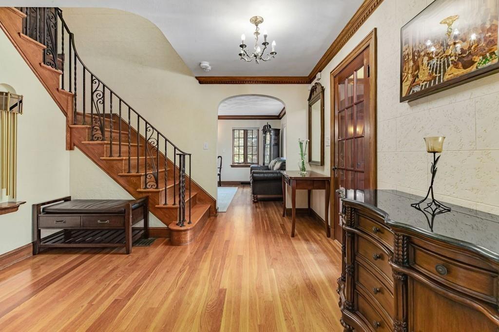 132 Beverly Road Brookline, MA 02467 - Photo 8 of 36 a view of entryway and hall with wooden floor
