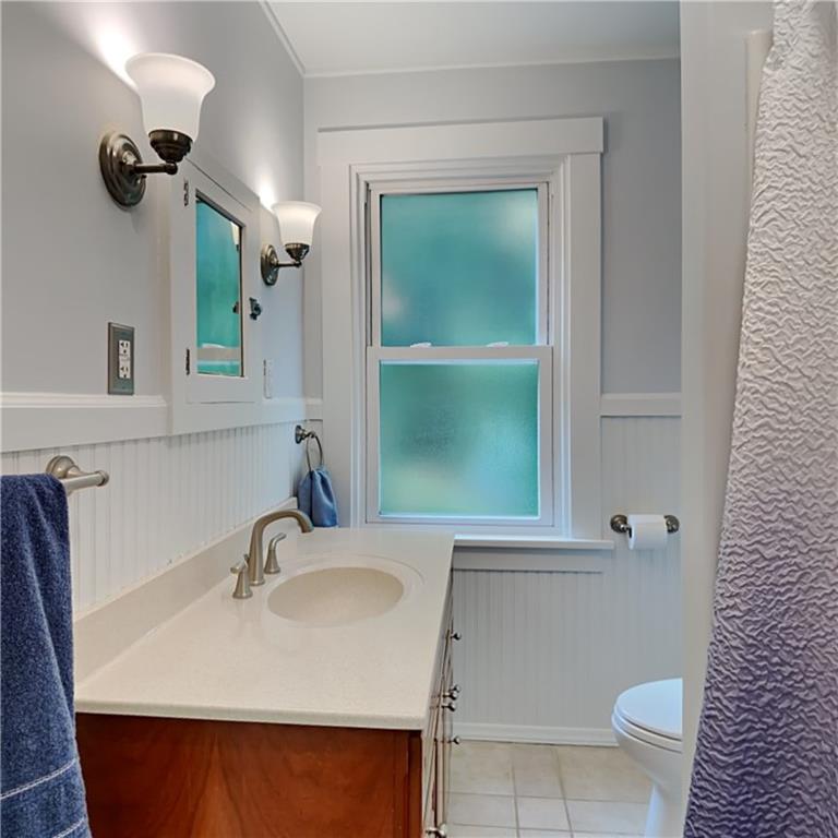 9735 Valley View Road Pittsburgh, PA 15237 - Photo 15 of 25 a bathroom with a sink and a mirror