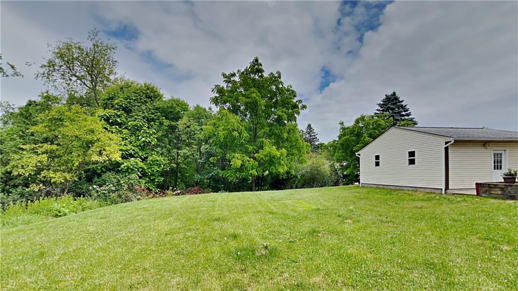 9735 Valley View Road Pittsburgh, PA 15237 - Photo 23 of 25 a view of a house with a yard and garage