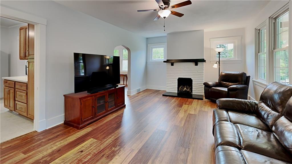 9735 Valley View Road Pittsburgh, PA 15237 - Photo 5 of 25 a living room with furniture fireplace and flat screen tv