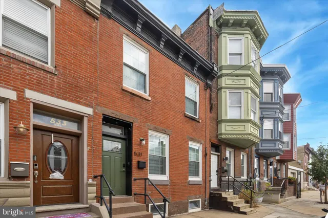 a view of a building with a street