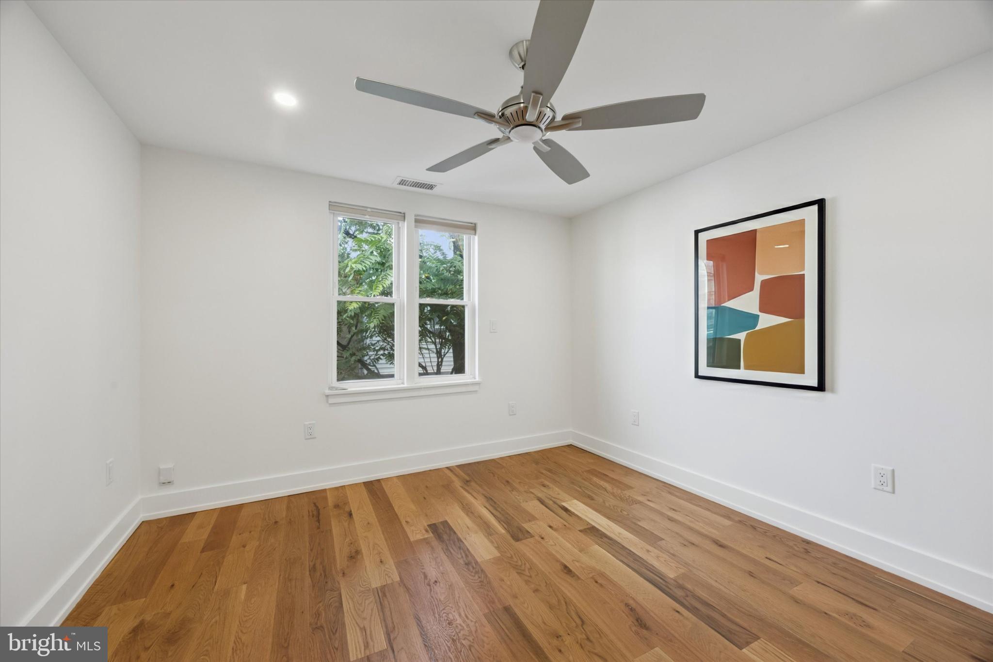 531 Mifflin Street Philadelphia, PA 19148 - Photo 14 of 28 a view of an empty room with wooden floor and a window