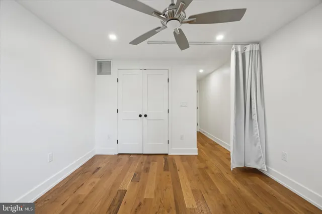 a bedroom with a bed and flat screen tv
