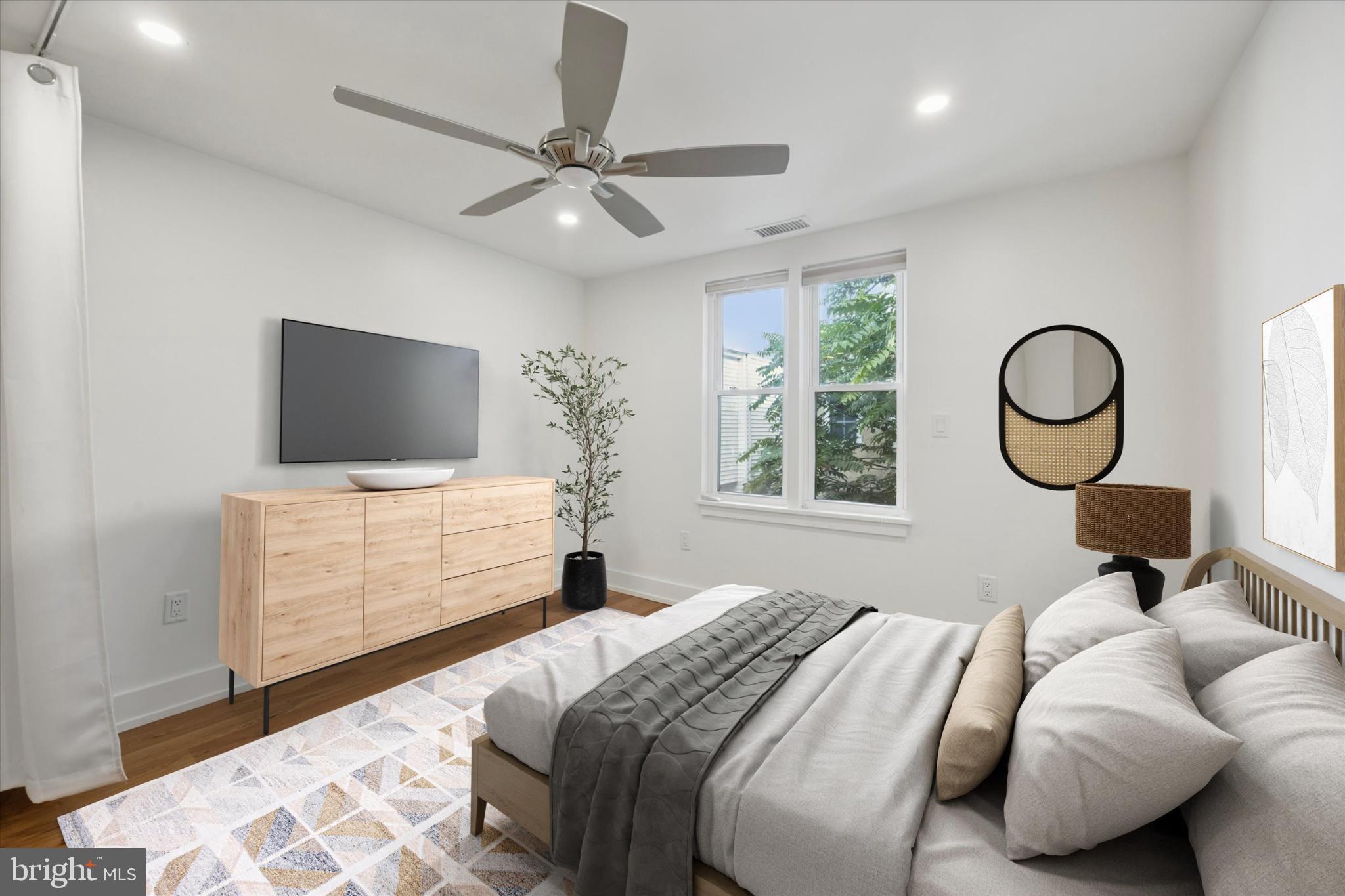 531 Mifflin Street Philadelphia, PA 19148 - Photo 16 of 28 a bedroom with a bed and flat screen tv